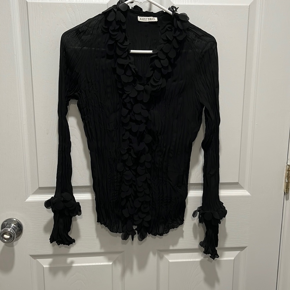 Beautiful sheer crinkly black blouse with ruffled neck and button line!